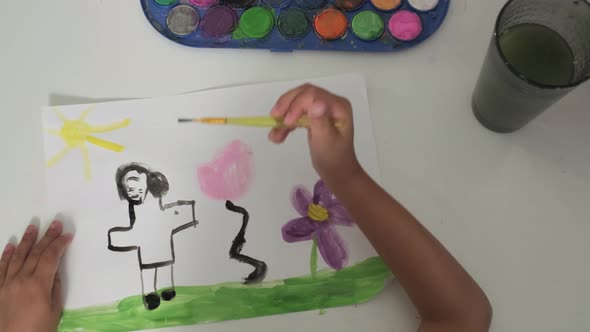 Talented Creative Child Girl Female Artist Draws with Her Hands on Paper Using Fingers Paints Brush