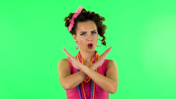 Woman Strictly Gesturing with Hands Crossed Making X Shape Meaning Denial Saying NO. Green Screen alt