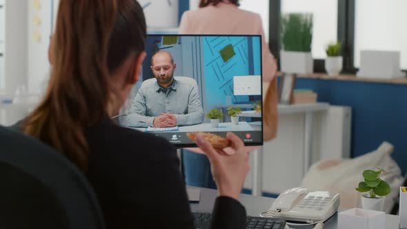 Businesswoman Discussing with Remote Entrepreneur During Online Videocall Meeting Conference alt