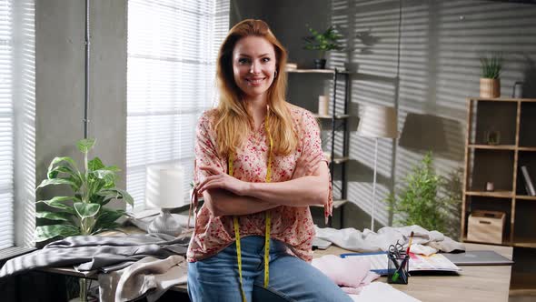 Female Designer of Clothes Standing in Office Attractive Tailor Posing Looking at Camera Smiling alt