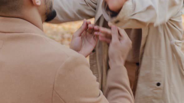 Young Man Back View Kneeling in Front Beloved Girlfriend Makes Promise Proposes Get Married in alt