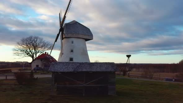 Old Araisi Windmill in Latvia Aerial Shot From Above. Winter Day at Sunrise 4K Video alt
