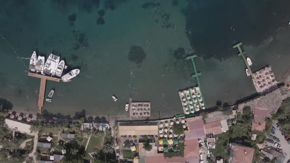 aerial view of a beautiful beach and boats. swimming people aerial.