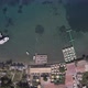 aerial view of a beautiful beach and boats. swimming people aerial. - VideoHive Item for Sale