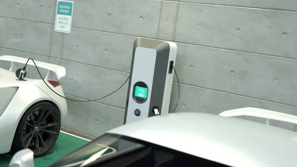 Electric cars connected to the charging station. Vehicles using renewable energy alt