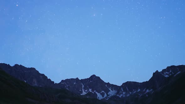 8K Stars in the sky transition from day to night in the mountains