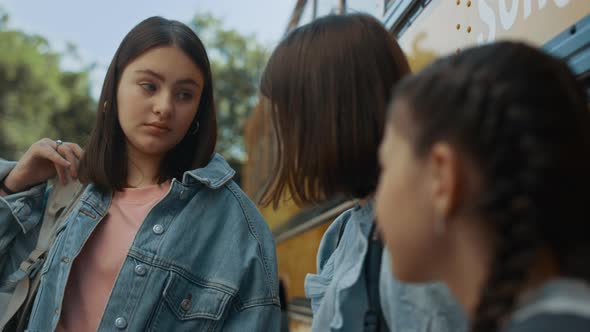 Cute School Girl Telling Funny Story to Friends Close Up alt