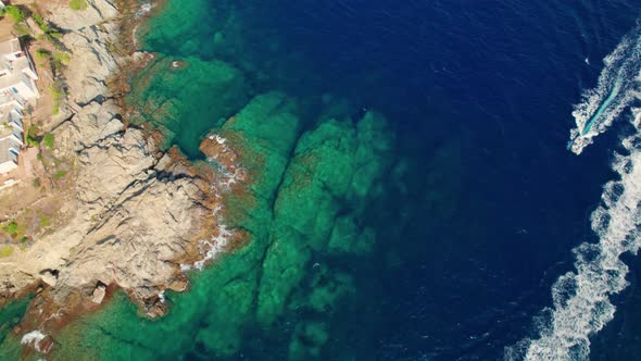 Drone Over Boats In Sea Just Off Coastline Of Cap De Creus alt
