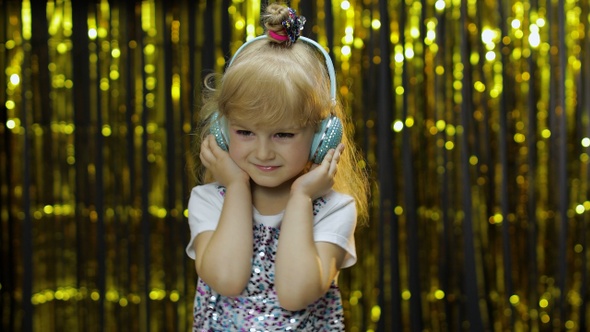 Child Dances, Listens Music on Headphones. Little Kid Girl Dancing, Having Hun, Relaxing, Enjoying alt