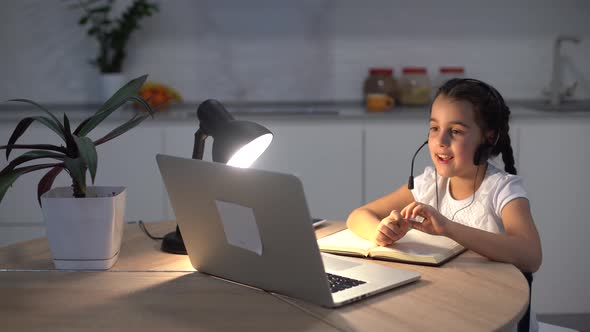 Positive Kid Girl Study Remote Sit Desk Table Use Laptop Have Online Communication Lesson alt