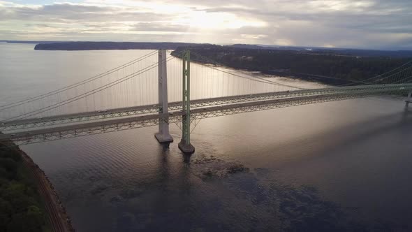 Wide establishing drone shot of the Tacoma Narrows Bridge, circa 2015. alt