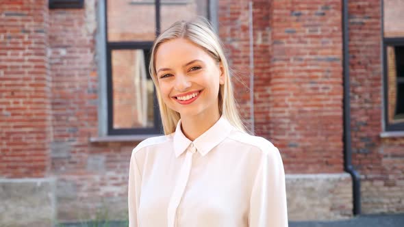 Closeup Face of Beautiful Blond Sexy Smiling Woman with Light Hair Outdoor alt