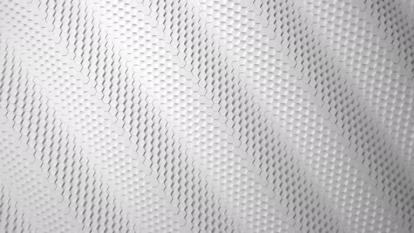Wave motion mosaic surface with moving white hexagons.