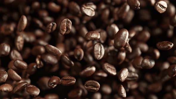 Super Slow Motion Shot of Exploding Premium Coffee Beans Towards the Camera at 1000Fps alt