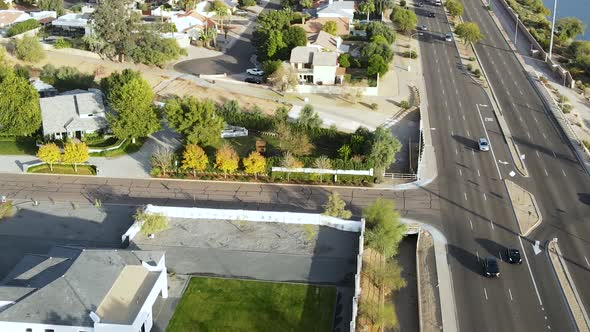 City Streets and Suburbs Neighborhoods in Arizona. Aerial Tilt-Up Reveal alt