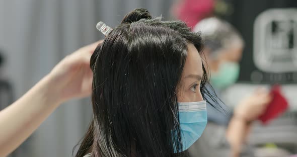 Woman Dye Hair Color at Beauty Salon