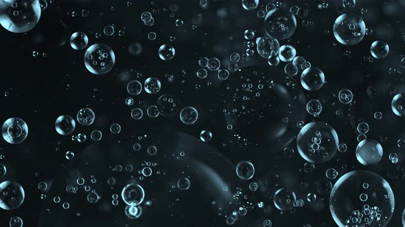 Super Slow Motion Shot of Moving Blue Bubbles Isolated on Black Background at 1000Fps alt