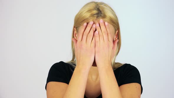 A Young Attractive Woman Plays Peek-a-boo with the Camera - Closeup - White Screen Studio alt