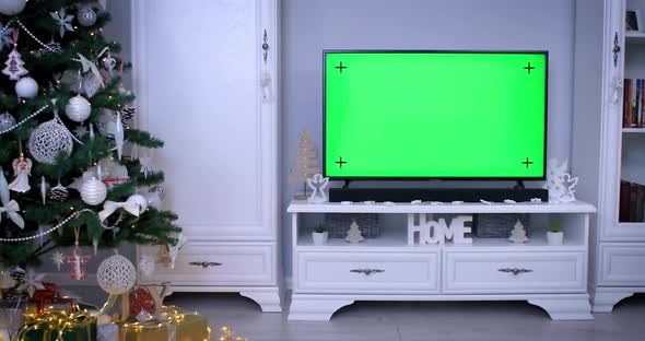 Smart Tv with Green Screen near Christmas Tree