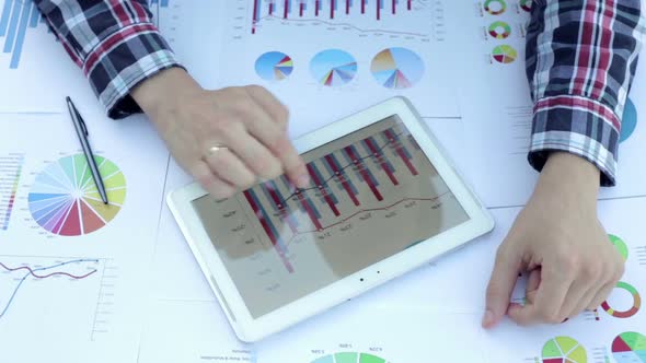 Businessman Works with Charts alt