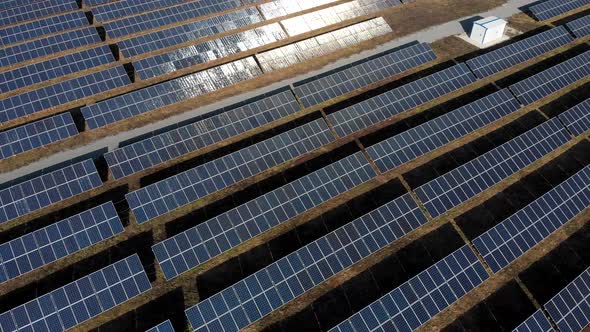 Solar Power Station, Solar Panels Stand in a Row in the Fields, Green Energy and Electrics