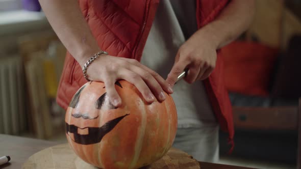 Carving Process of a Halloween Pumpkin Closeup alt