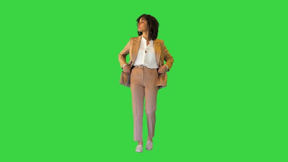 Young African American Girl Walking and Sightseeing on a Green Screen Chroma Key alt