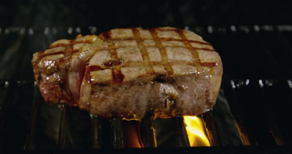 Juicy Filet Mignon On BBQ Flaming Grill 21b