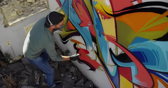 Graffiti artist painting with aerosol spray 4k alt