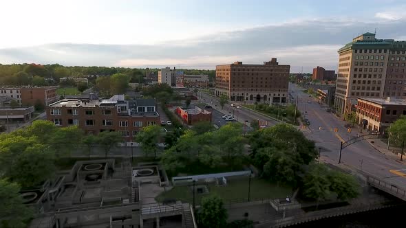 A drone flies over South Saginaw Street in Flint, Michigan approaching flying over the Vehicle City alt