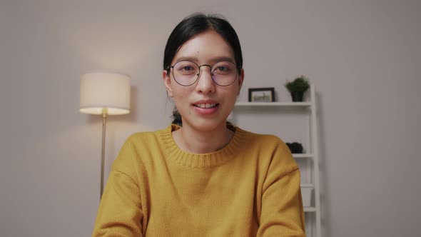 Portrait of a young businesswoman wearing glasses and online meeting. alt