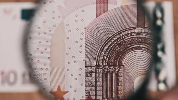 Ten Euro Under Magnifying Glass alt