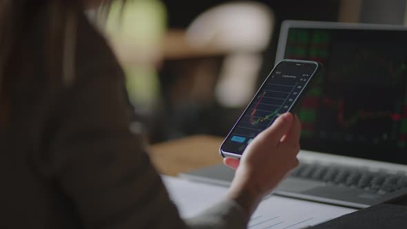 Investor Checking Stock Market Data On Screen Mobile Phone alt