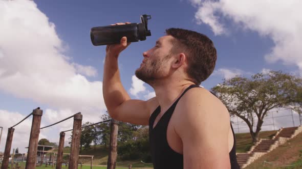 Young adults training at an outdoor gym bootcamp alt