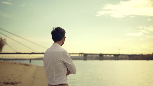 Businessmen In Pants Stroll On City Sands Beach. Man Walking On City Beach. Guy Walks On Sand. alt