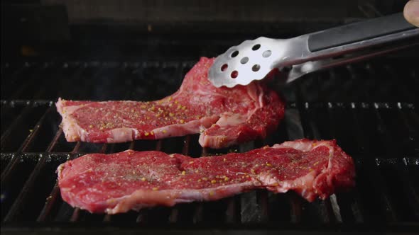 Delicious Steaks Placed On Hot Grill