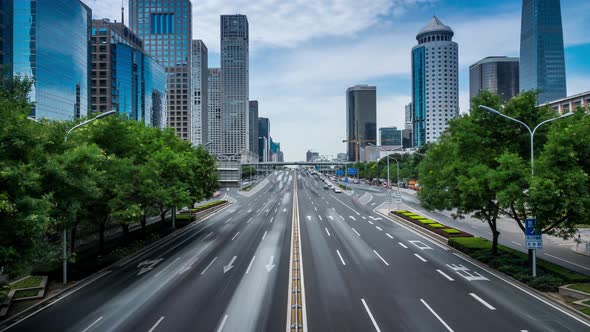 Time lapse of busy traffic and modern buildings in Beijing city , China. alt