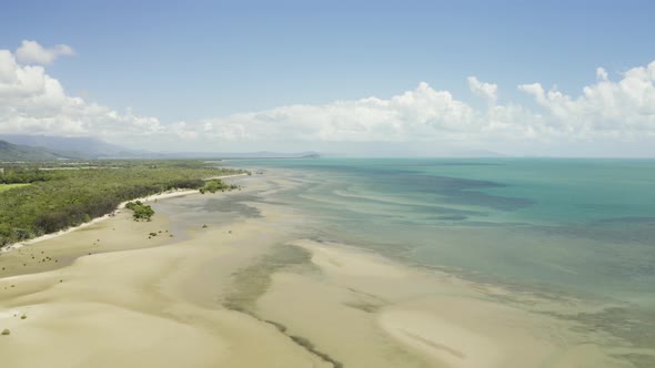 Aerial, Low Tide And Huge Sand Ocean Bed And Mangroves Growing In Queensland Australia