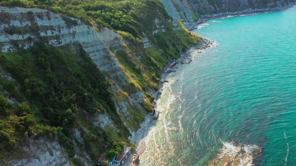 Aerial View of Rocky Coastline Down Blue Sea Deep White Cliffs alt