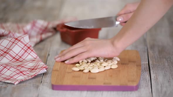 Cutting Almonds on a Wood Board