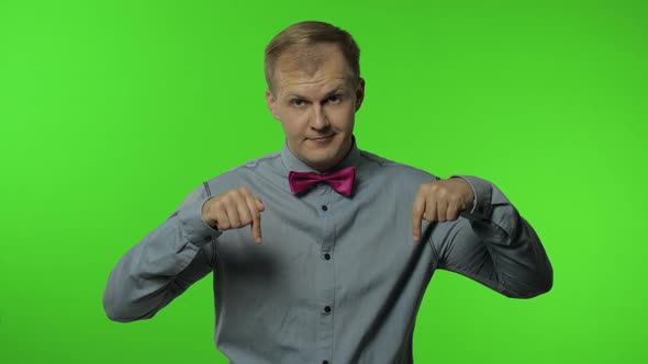 Man Asking To Subscribe, Trying To Control, Pointing Fingers Down. Guy on Chroma Key Background alt