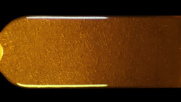 Oil Texture in Motion. Natural Components Nutrition and Moisture Concept. Hair Care and Restore