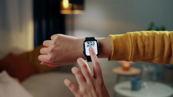 Woman Showing Vaccination Passport on Smartwatches Covid Qr Code Closeup International Coronavirus alt