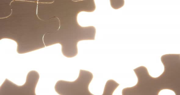 Hand of person solving a puzzle alt