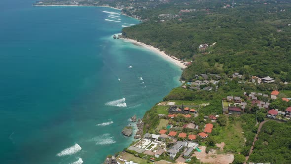 Panoramic Aerial View of Luxury Holiday Homes and Resorts on Top of the Cliff Overlooking Blue Ocean alt