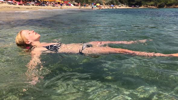 Woman enjoys French coast beach water  slow-mo 1920X1080 HD footage - Female in  crystal clear sea s