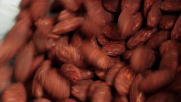 Almond in Chocolate Production of Nuts in Dark or Milk Chocolate alt
