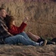Happy Man and Woman Relaxing on Beach - VideoHive Item for Sale