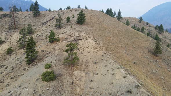 Aerial footage of Canada's driest and hottest region during wildfire season in 2021. Wide angle fly alt