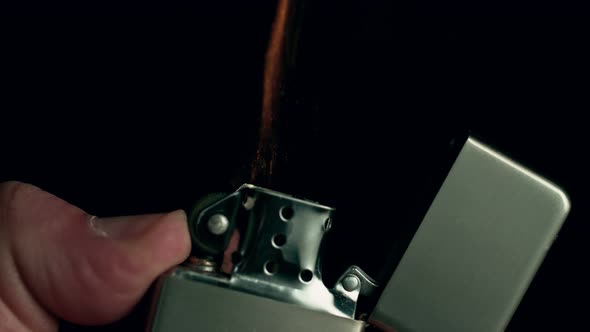 Super Slow Motion Shot of Igniting Metallic Lighter at 1000Fps alt